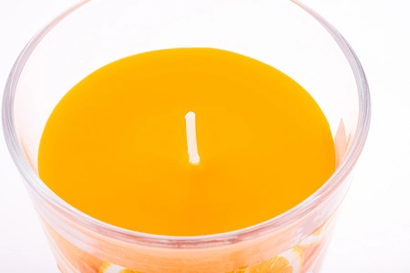 Oranžová vonná dekorativní svíčka ve skle